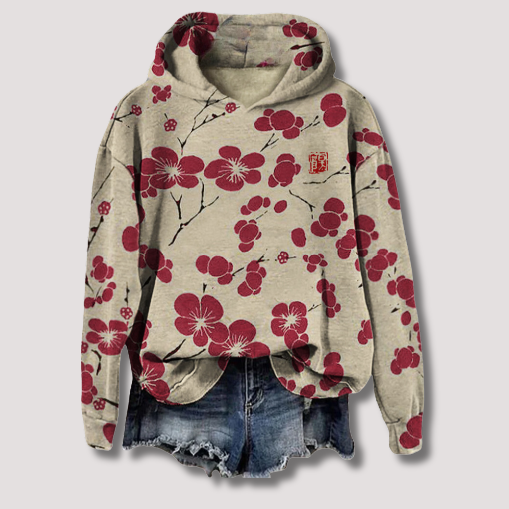 Let sweater med blomsterprint og hætte