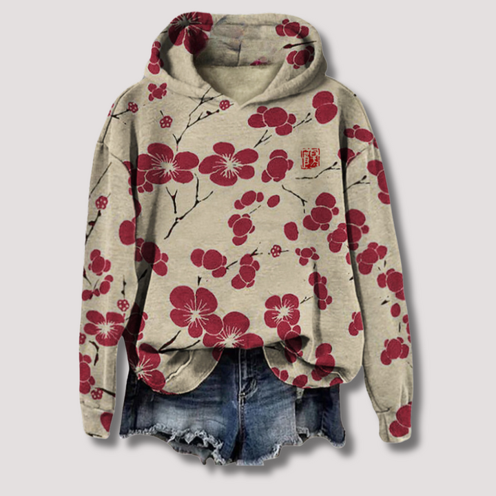 Let sweater med blomsterprint og hætte