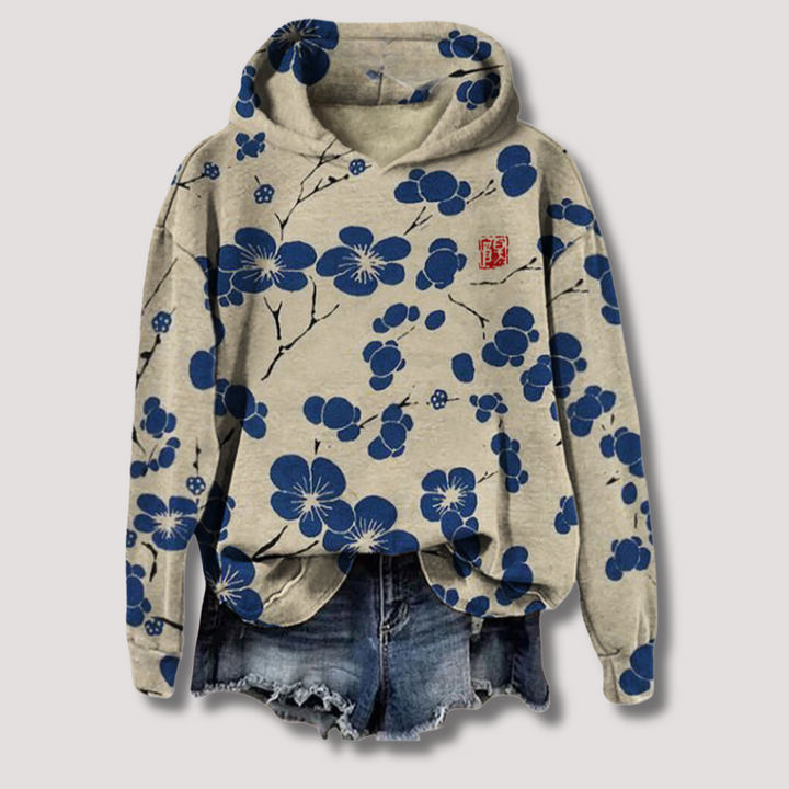 Let sweater med blomsterprint og hætte