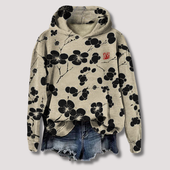 Let sweater med blomsterprint og hætte