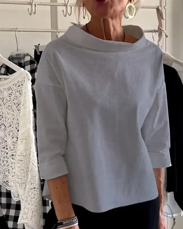 Casual top med brede revers og halv rullekrave for et stilfuldt look