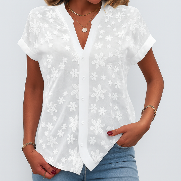Kortærmet bluse med blomsterprint til kvinder