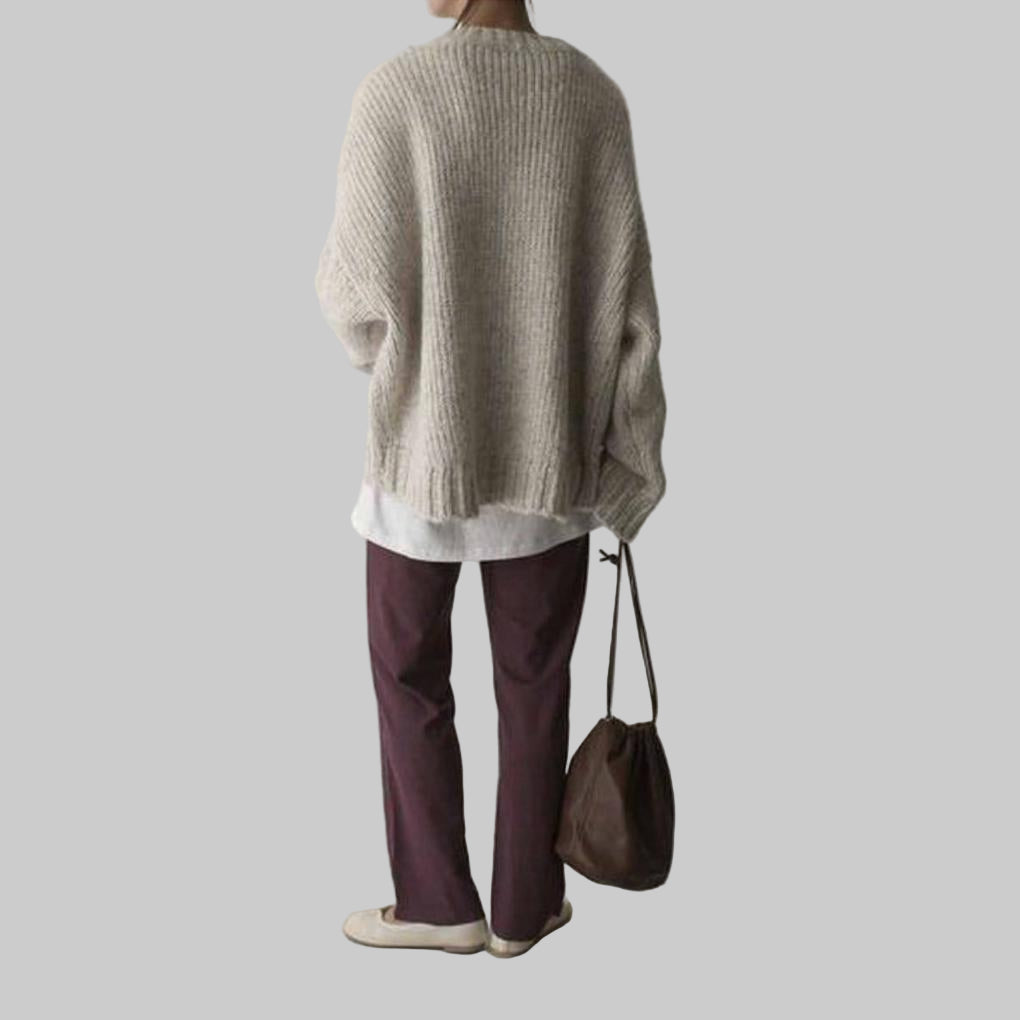 Overdimensioneret elfenbensfarvet sweater med lomme foran
