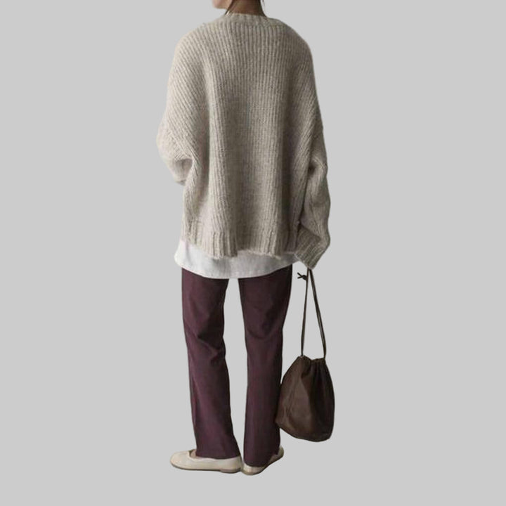 Overdimensioneret elfenbensfarvet sweater med lomme foran